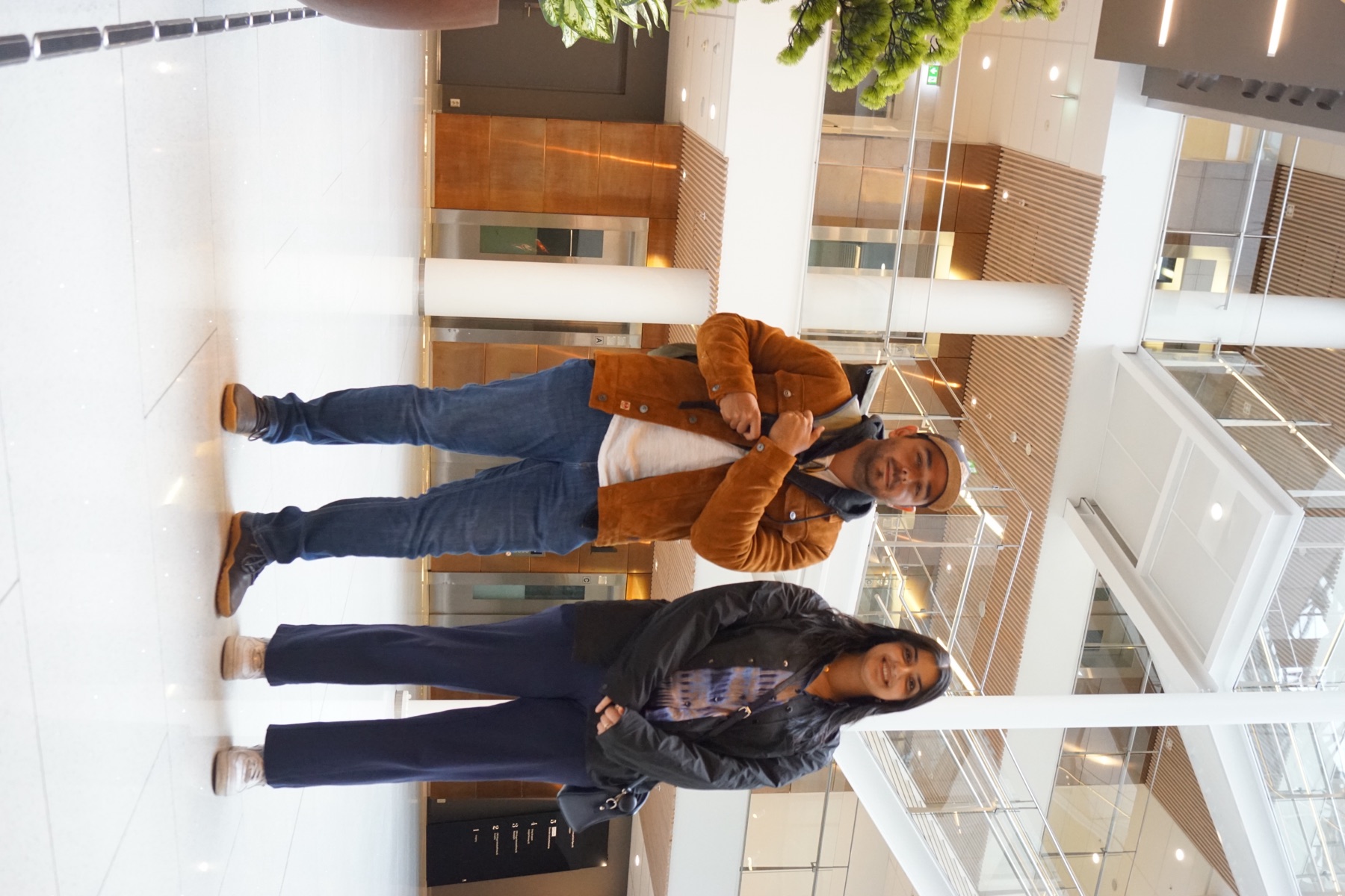 TekAI team members in office atrium